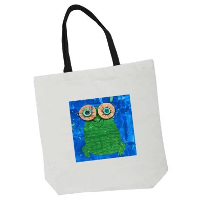 white tote bag with black handles and artwork
